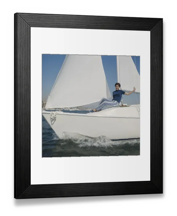 Framed Print : Woman sitting on sailing boat, portrait Framed Print : Woman sitting on sailing boat, portrait