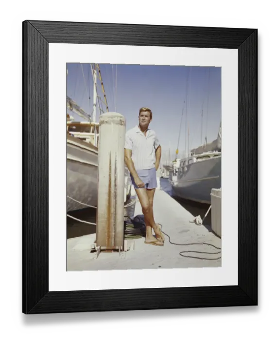 Framed Print : Young man standing at harbour Framed Print : Young man standing at harbour