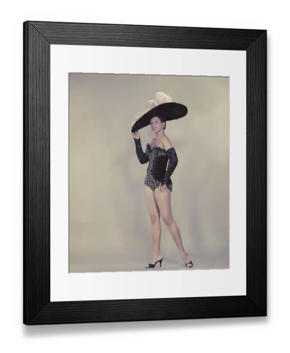 Framed Print : Young woman wearing large dress hat, smiling, portrait Framed Print : Young woman wearing large dress hat, smiling, portrait