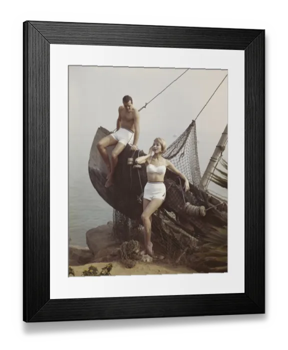 Framed Print : Couple leaning on boat at sea side Framed Print : Couple leaning on boat at sea side