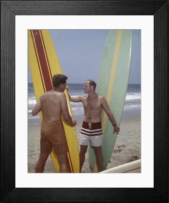 Framed Print : Surfers holding surfboards on beach Framed Print : Surfers holding surfboards on beach