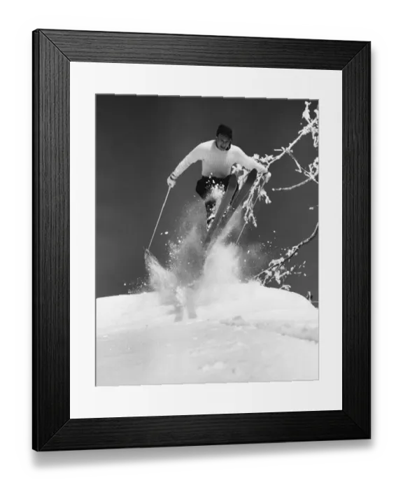 Framed Print : Man jumping through air on skis Framed Print : Man jumping through air on skis