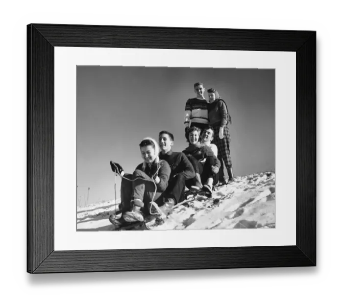 Framed Print : Group of friends tobogganing