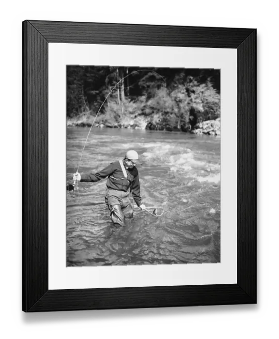 Framed Print : Man catching fish in river Framed Print : Man catching fish in river