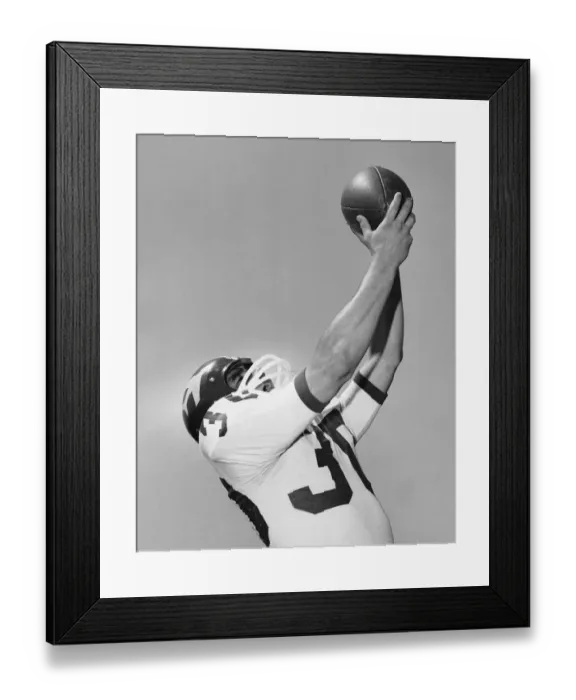 Framed Print : Man catching football Framed Print : Man catching football
