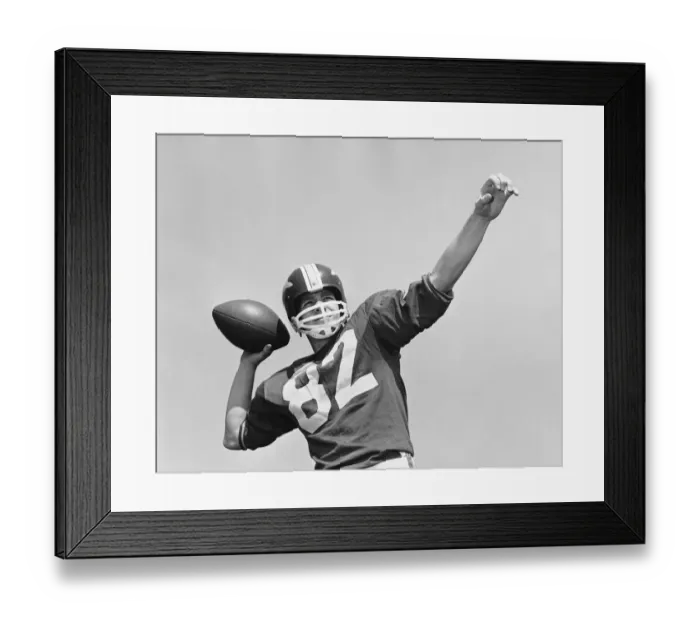 Framed Print : Man throwing football Framed Print : Man throwing football