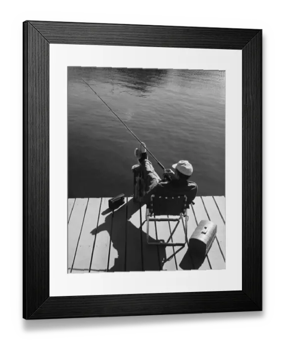 Framed Print : Man fishing from dock