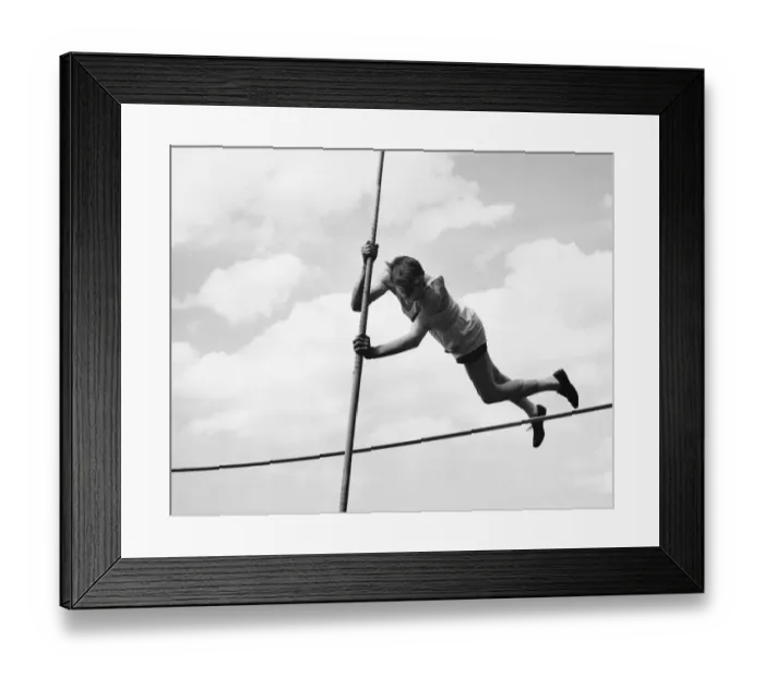 Framed Print : Male pole-vaulter clearing bar Framed Print : Male pole-vaulter clearing bar