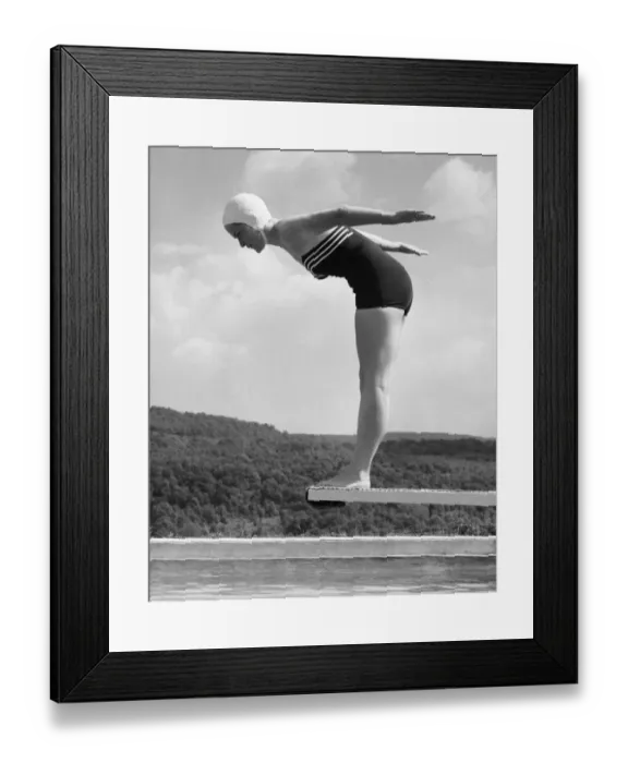 Framed Print : Woman preparing to dive into pool Framed Print : Woman preparing to dive into pool