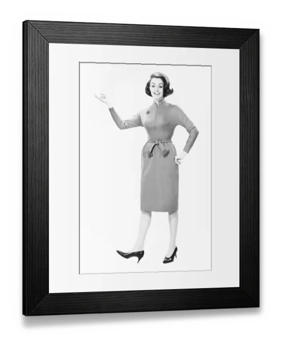 Framed Print : Elegant woman standing in studio, gesturing, (B&W), portrait Framed Print : Elegant woman standing in studio, gesturing, (B&W), portrait
