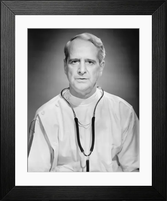 Framed Print : Physician posing in studio, (B&W), portrait Framed Print : Physician posing in studio, (B&W), portrait