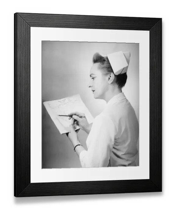 Framed Print : Nurse noting on patients chart, (B&W) Framed Print : Nurse noting on patients chart, (B&W)