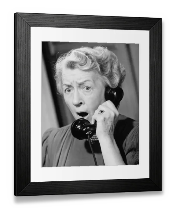 Framed Print : Shocked woman using phone, (B&W), close-up Framed Print : Shocked woman using phone, (B&W), close-up