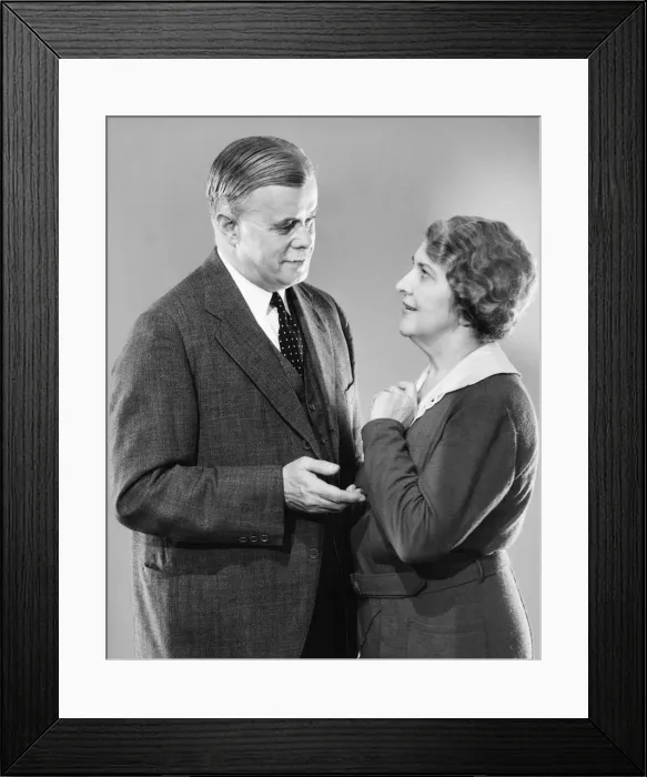Framed Print : Couple standing face to face, talking, (B&W) Framed Print : Couple standing face to face, talking, (B&W)