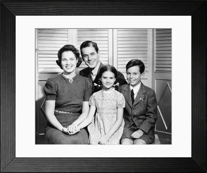 Framed Print : Family posing at home, children (8-9) (10-11), (B&W), portrait Framed Print : Family posing at home, children (8-9) (10-11), (B&W), portrait