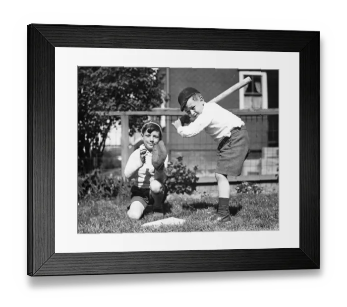 Framed Print : Two boys (6-7) playing baseball in garden, (B&W) Framed Print : Two boys (6-7) playing baseball in garden, (B&W)