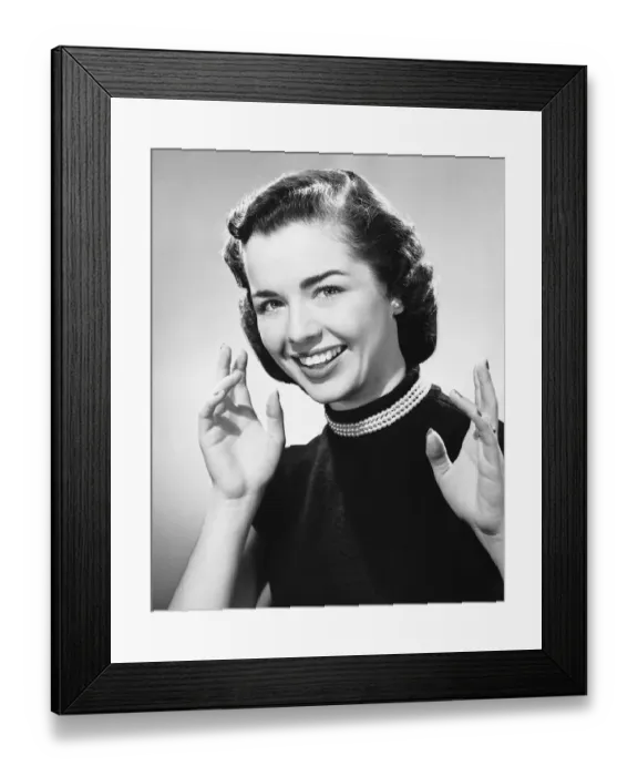 Framed Print : Woman smiling, displaying hands Framed Print : Woman smiling, displaying hands