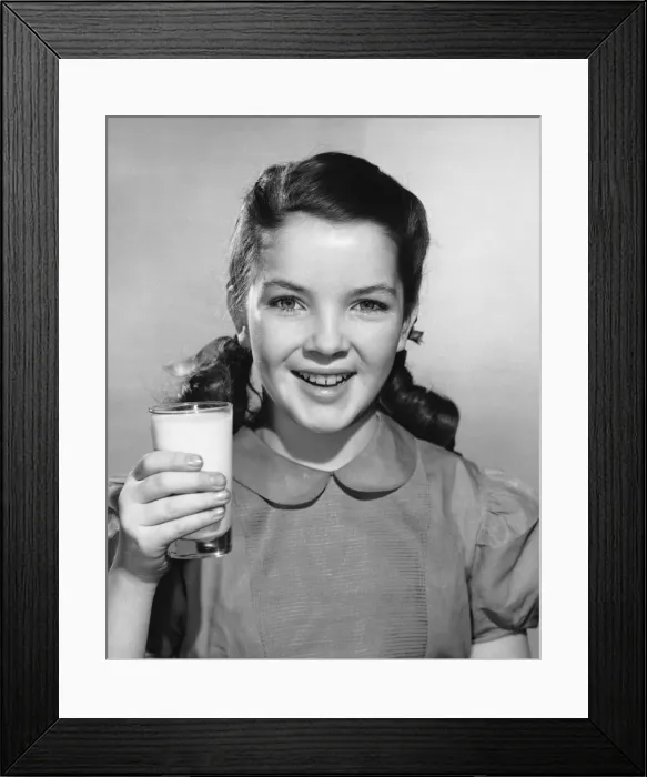 Framed Print : Girl holding glass of milk