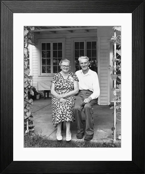 Framed Print : Man and woman sitting on porch Framed Print : Man and woman sitting on porch