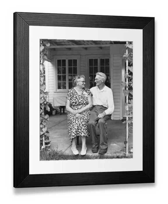 Framed Print : Man and woman sitting on porch Framed Print : Man and woman sitting on porch