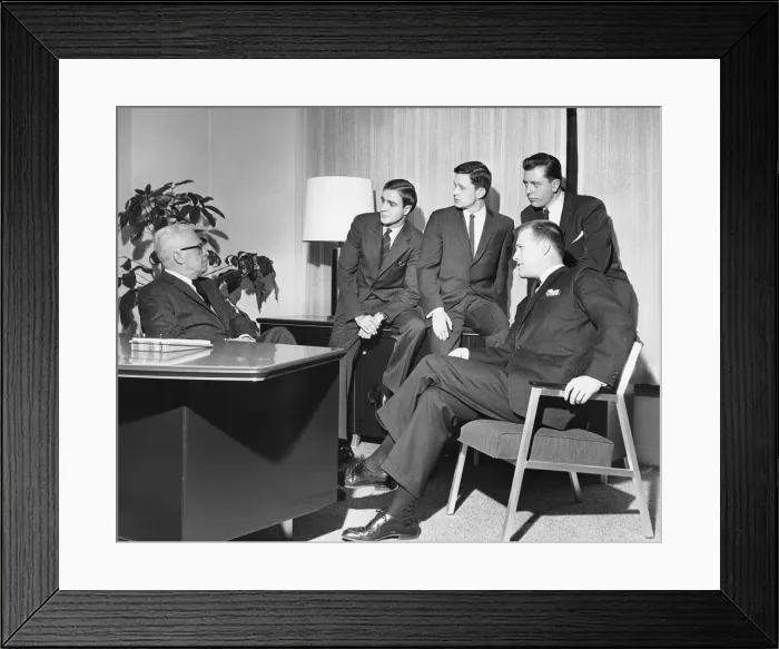 Framed Print : Men looking at group in meeting Framed Print : Men looking at group in meeting