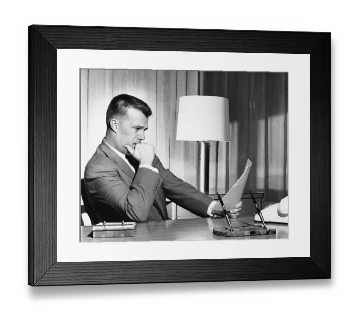 Framed Print : Man reading document Framed Print : Man reading document