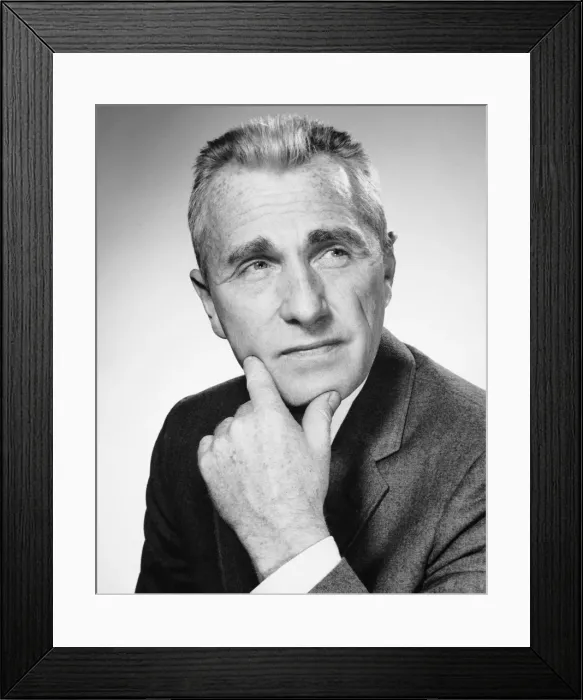 Framed Print : Man holding chin and looking upward Framed Print : Man holding chin and looking upward