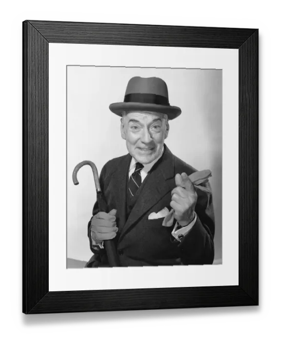 Framed Print : Man pointing, holding umbrella and glove Framed Print : Man pointing, holding umbrella and glove