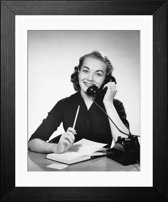 Framed Print : Woman using phone and holding pencil Framed Print : Woman using phone and holding pencil
