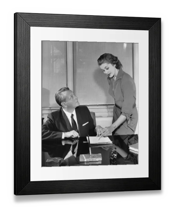 Framed Print : Woman and man talking and pointing to paper Framed Print : Woman and man talking and pointing to paper