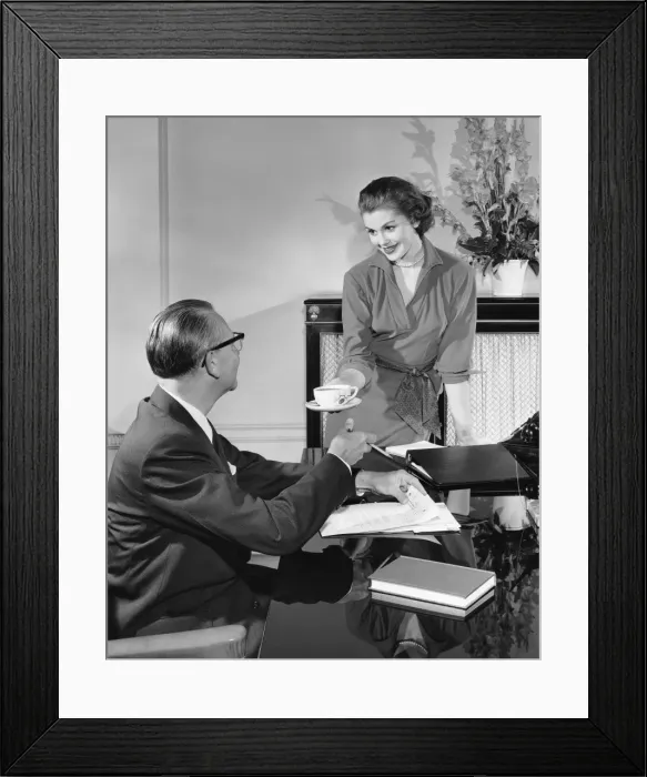 Framed Print : Woman giving cup to man Framed Print : Woman giving cup to man