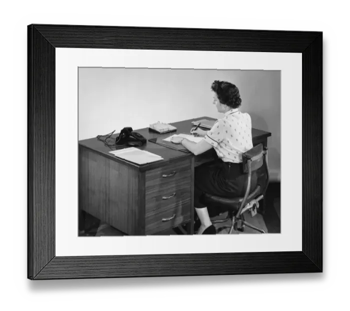 Framed Print : Back view of woman writing and looking at phone Framed Print : Back view of woman writing and looking at phone