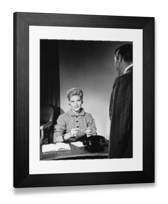 Framed Print : Woman sitting, listening to man Framed Print : Woman sitting, listening to man