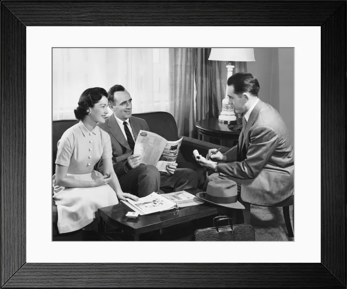 Framed Print : Husband and wife talking to salesman Framed Print : Husband and wife talking to salesman
