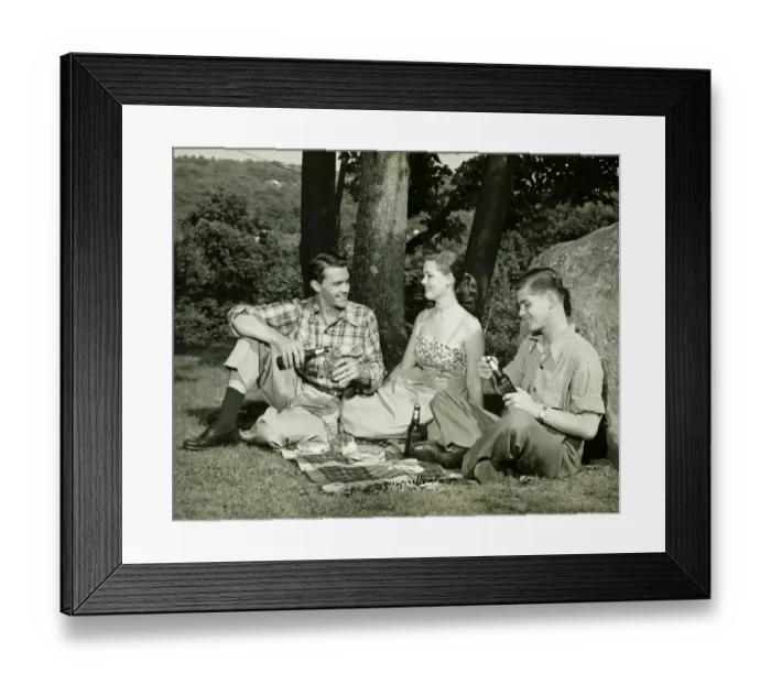 Framed Print : Woman and two men picnicking, (B&W)