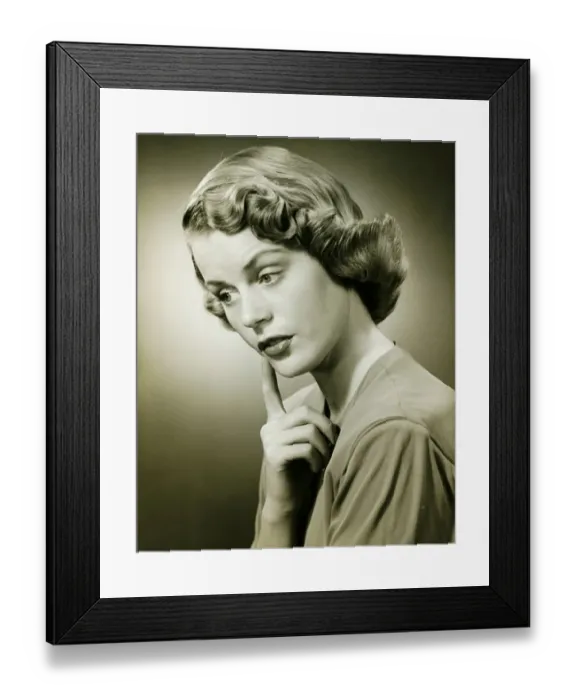 Framed Print : Woman looking thoughtful, posing in studio, (B&W), (Portrait) Framed Print : Woman looking thoughtful, posing in studio, (B&W), (Portrait)
