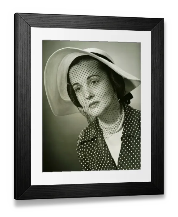 Framed Print : Sad woman in hat with veil posing in studio, (B&W), (Close-up), (Portrait) Framed Print : Sad woman in hat with veil posing in studio, (B&W), (Close-up), (Portrait)