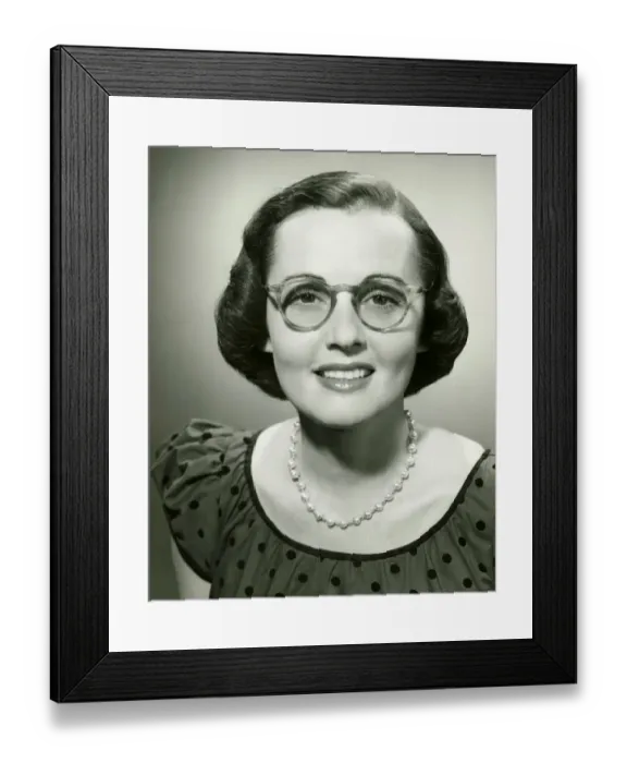 Framed Print : Woman wearing glasses posing in studio, (B&W), (Close-up), (Portrait) Framed Print : Woman wearing glasses posing in studio, (B&W), (Close-up), (Portrait)
