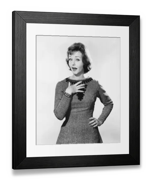 Framed Print : Woman with one hand on chest, other on hip, looking surprised Framed Print : Woman with one hand on chest, other on hip, looking surprised