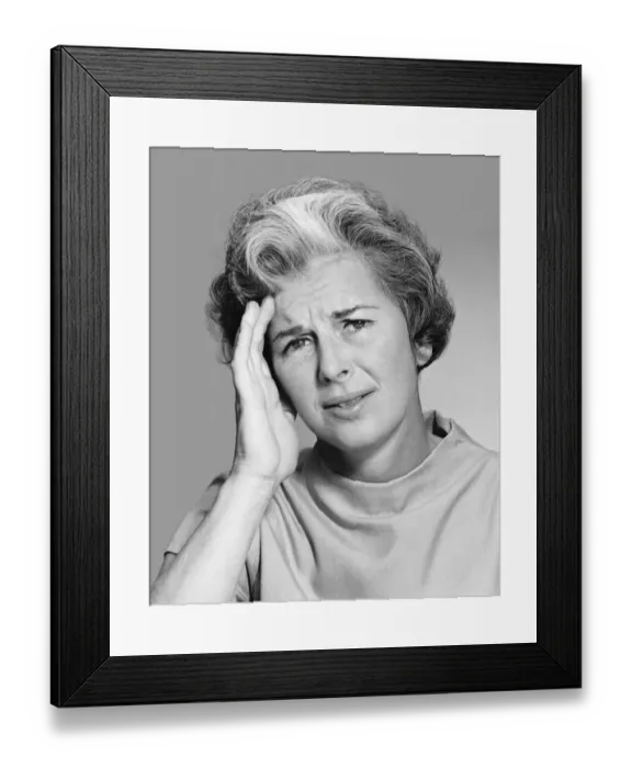 Framed Print : Woman rubbing forehead Framed Print : Woman rubbing forehead