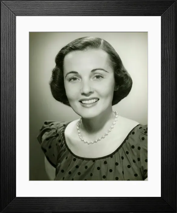 Framed Print : Woman in spotted dress posing in studio, (B&W), (Close-up), (Portrait) Framed Print : Woman in spotted dress posing in studio, (B&W), (Close-up), (Portrait)