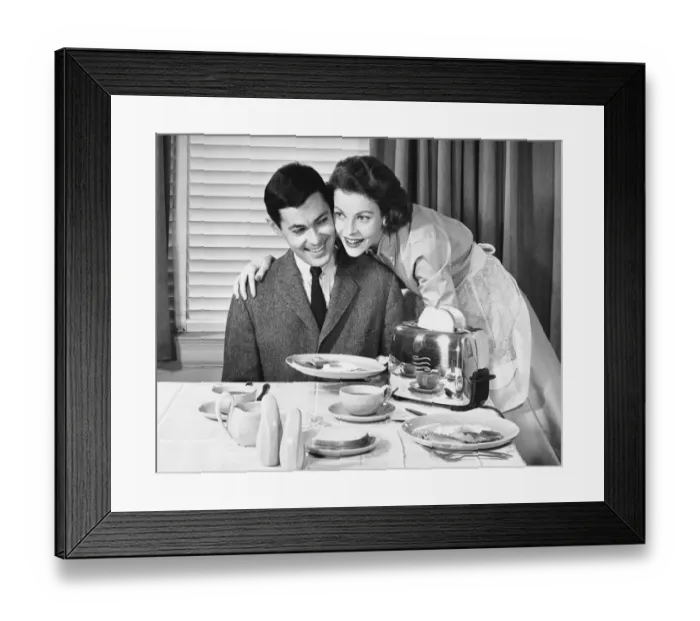 Framed Print : Woman serving a man breakfast Framed Print : Woman serving a man breakfast