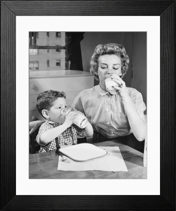 Framed Print : Mother and son drinking milk Framed Print : Mother and son drinking milk