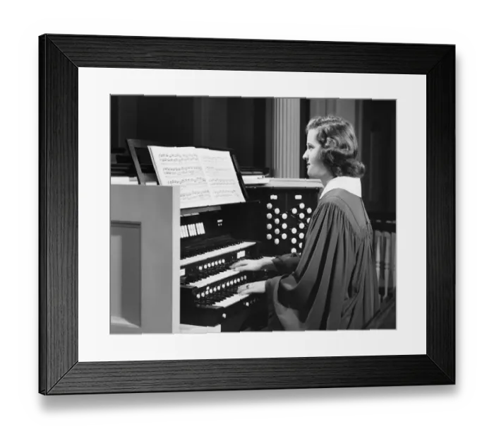 Framed Print : Woman playing organ in church
