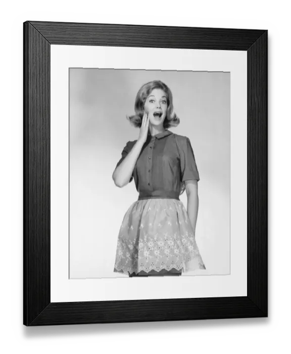 Framed Print : Woman wearing apron, gesturing Framed Print : Woman wearing apron, gesturing