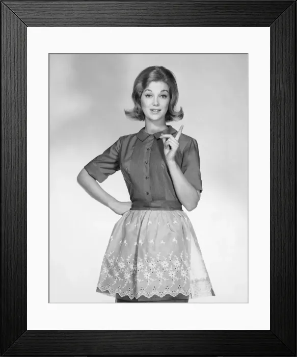Framed Print : Woman wearing apron, gesturing Framed Print : Woman wearing apron, gesturing