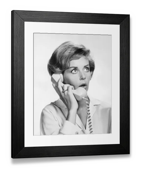 Framed Print : Woman talking on phone, looking surprised Framed Print : Woman talking on phone, looking surprised
