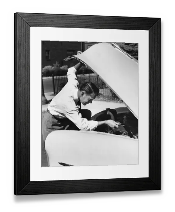 Framed Print : Man looking under hood of car Framed Print : Man looking under hood of car