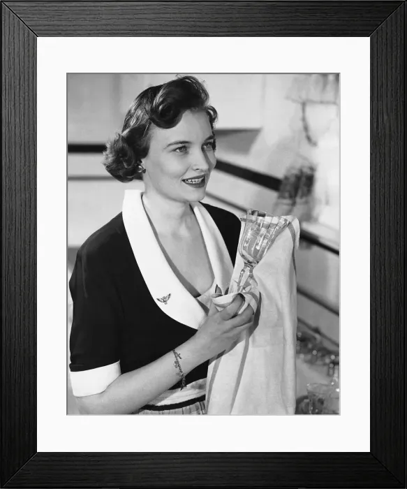 Framed Print : Woman drying wineglass Framed Print : Woman drying wineglass