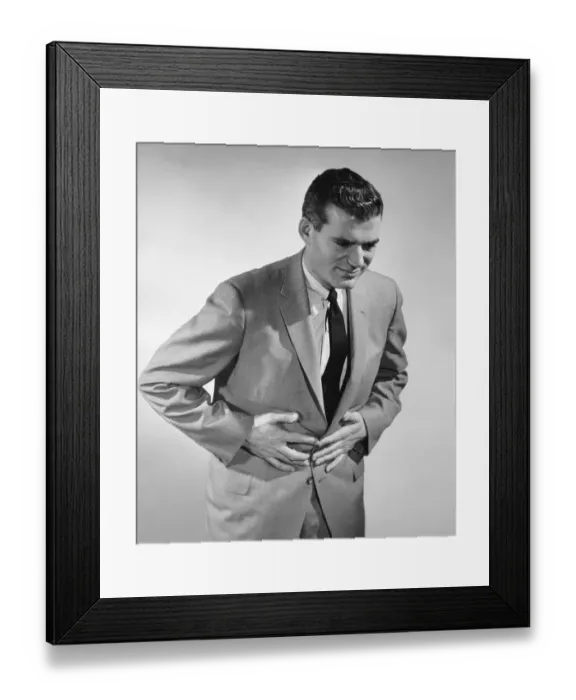 Framed Print : Man holding stomach